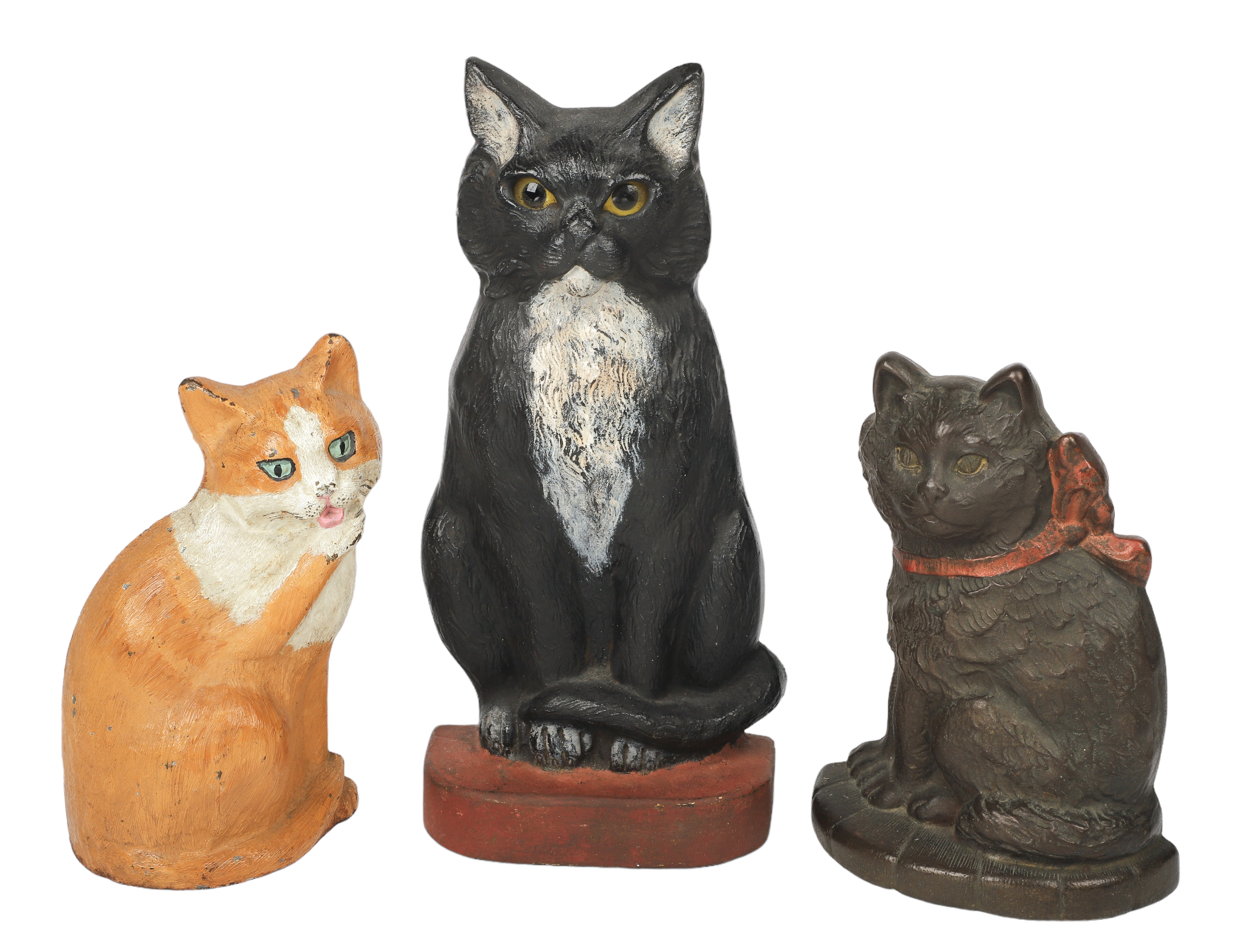 (3) Cast iron cat doorstops,