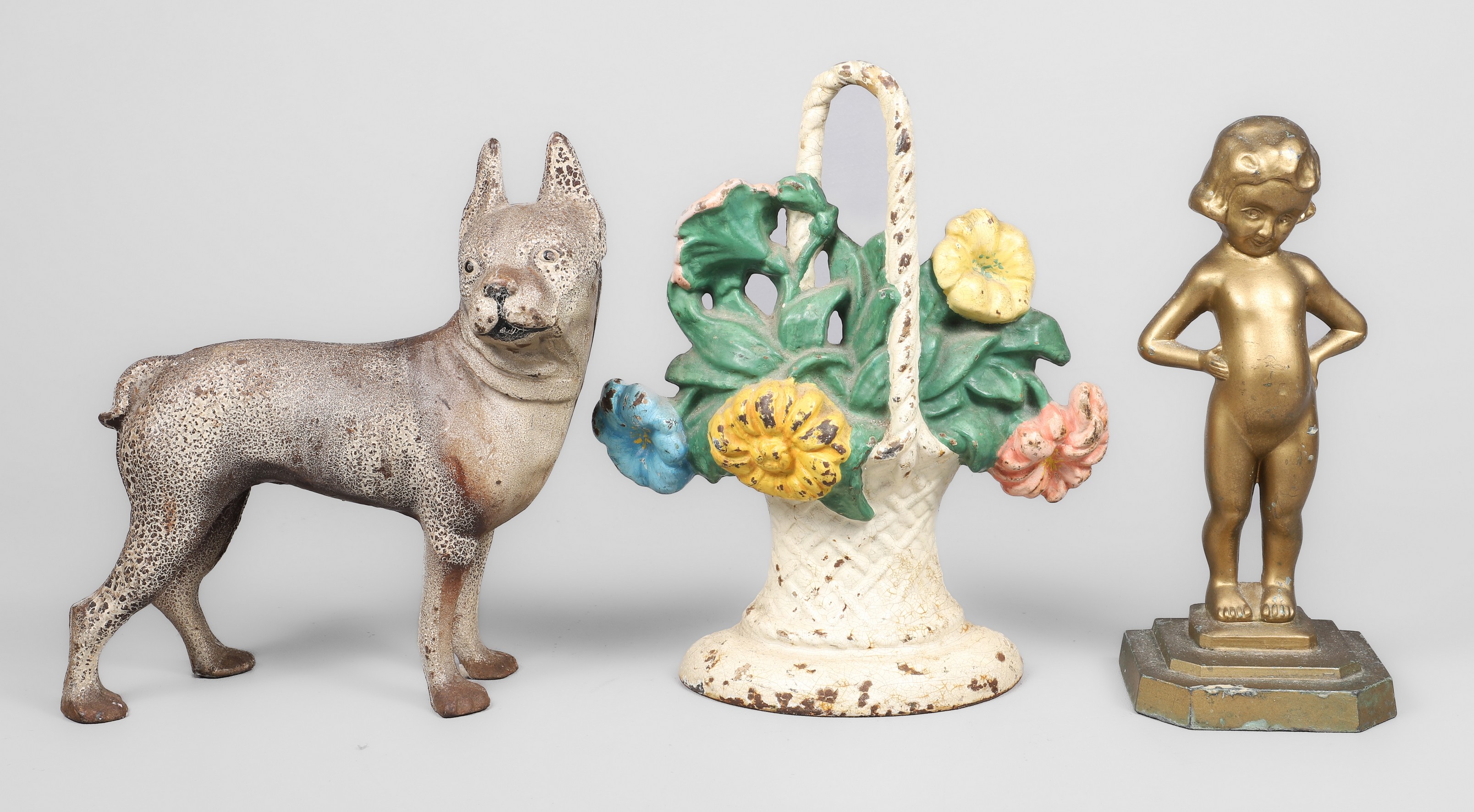 (3) Metal doorstops, c/o cast