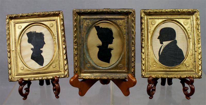 3 oval cut out paper silhouettes,