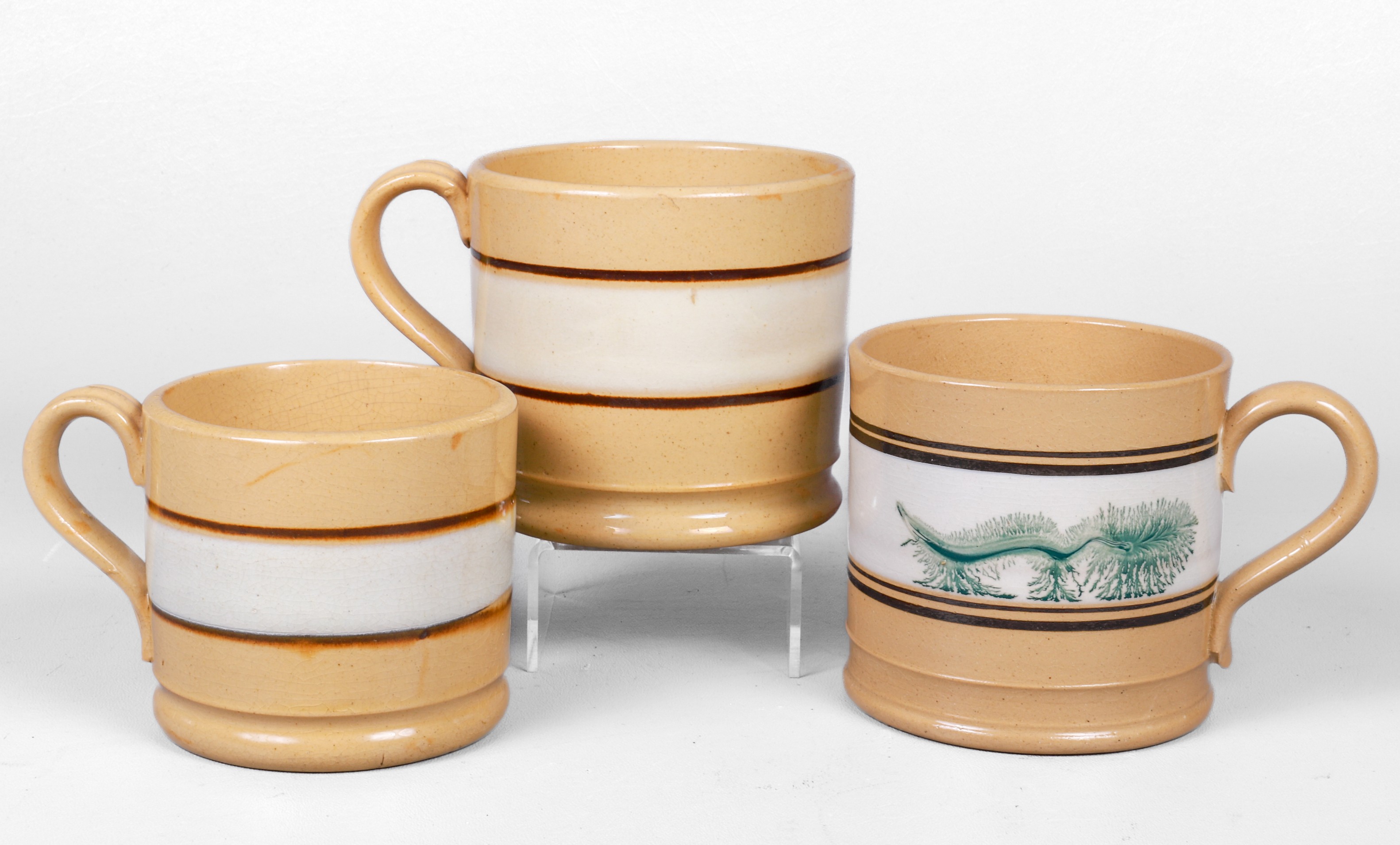 (3) Yellow ware pottery mugs,