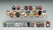 32 miniature pottery vessels:
