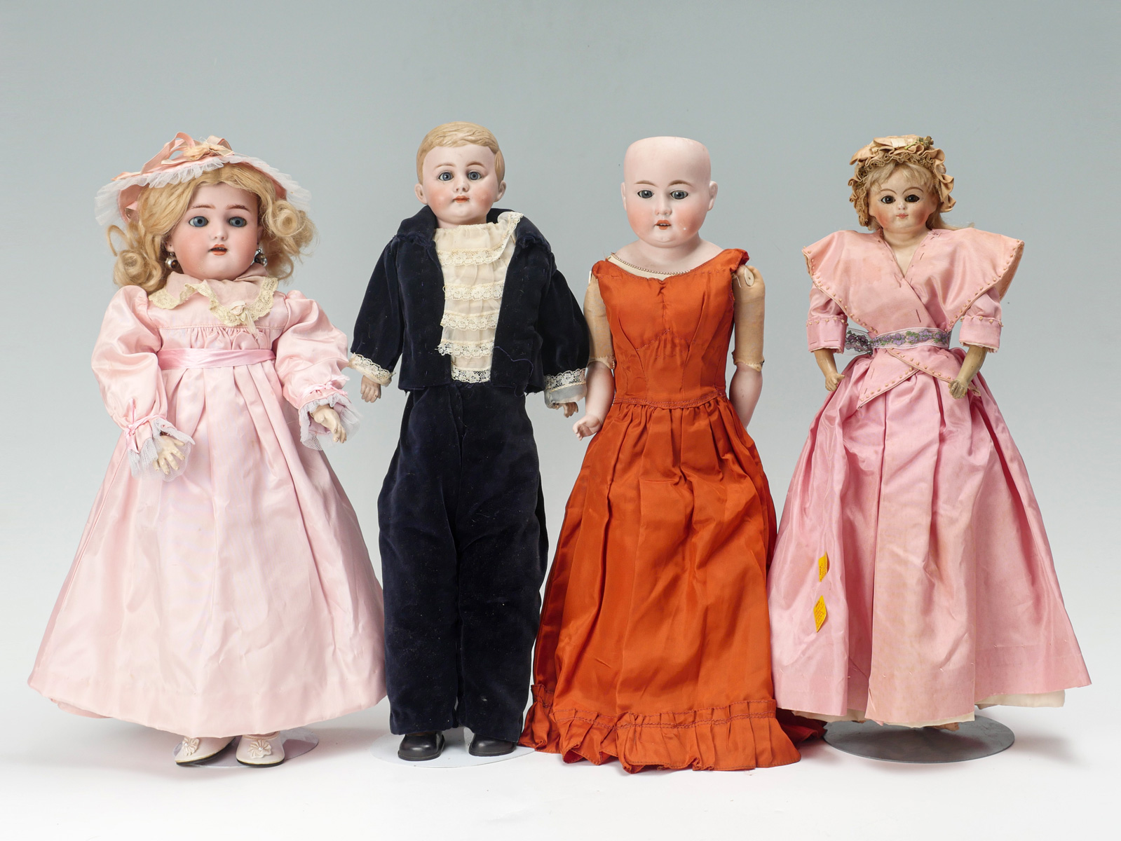 4 ANTIQUE BISQUE HEAD DOLLS: 1)