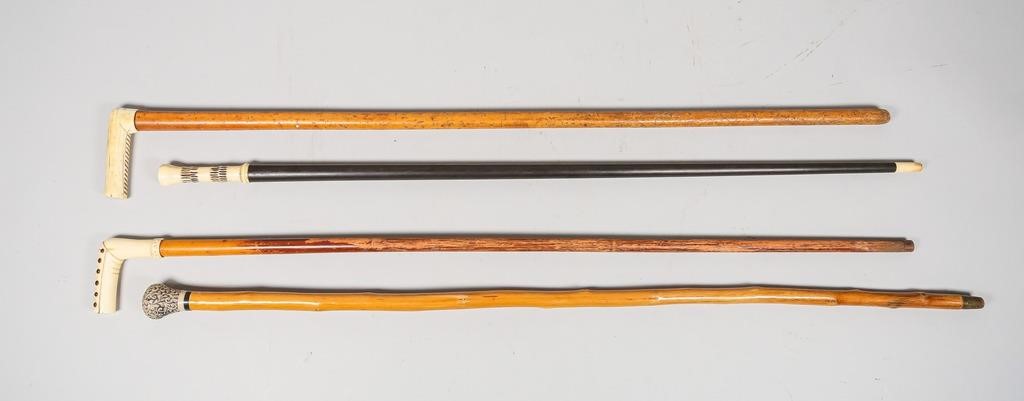 4 BONE HANDLED CANES4 carved bone