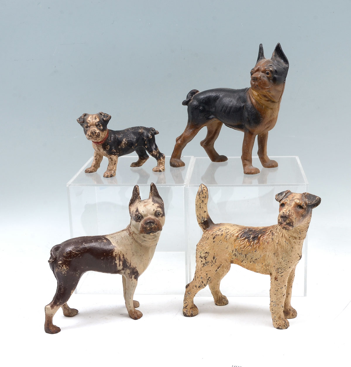 4 CAST IRON DOG DOORSTOPS: