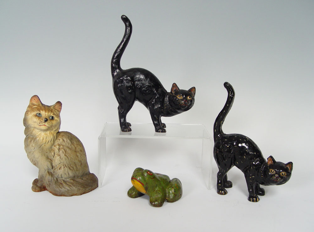 4 CAST IRON DOORSTOPS- 3 CATS AND A
