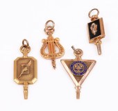 (4) Gold collegiate charms to