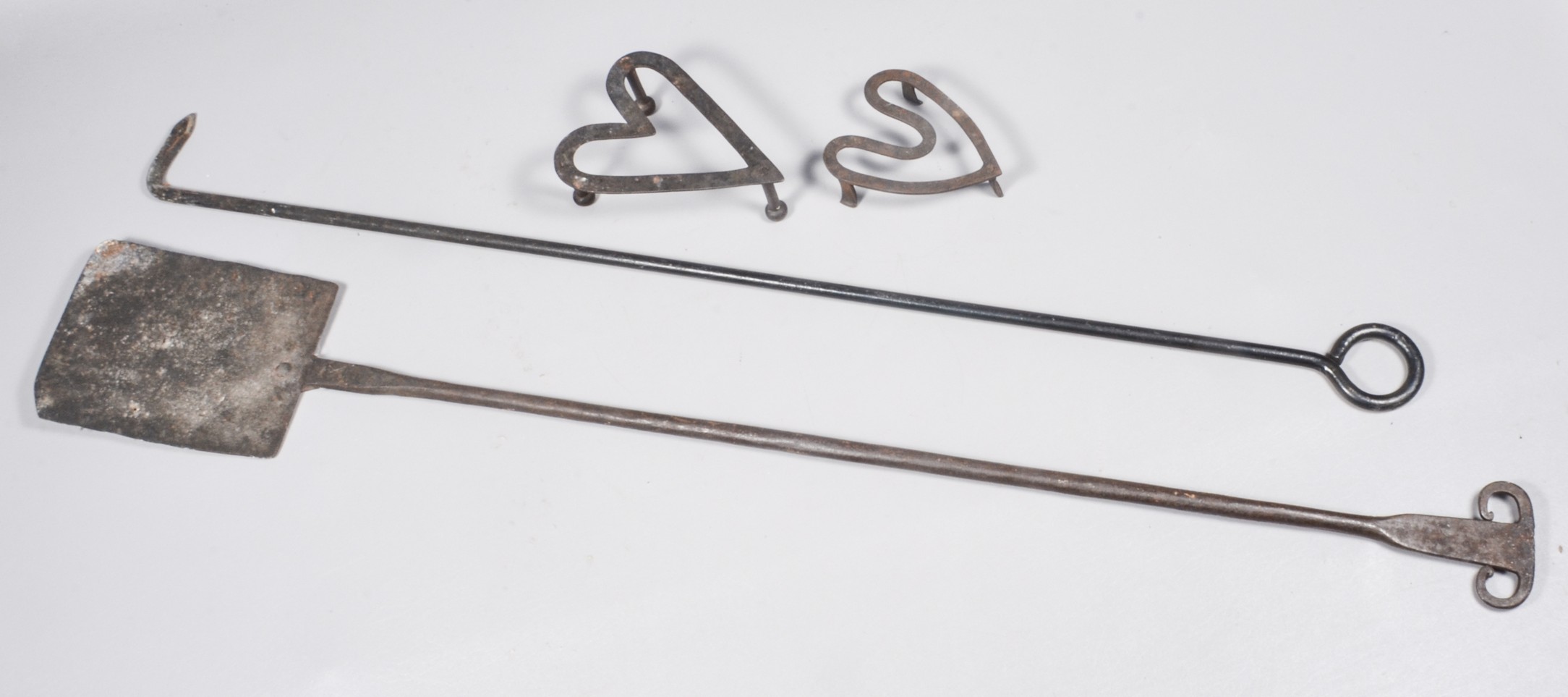 (4) Iron trivets and tools to
