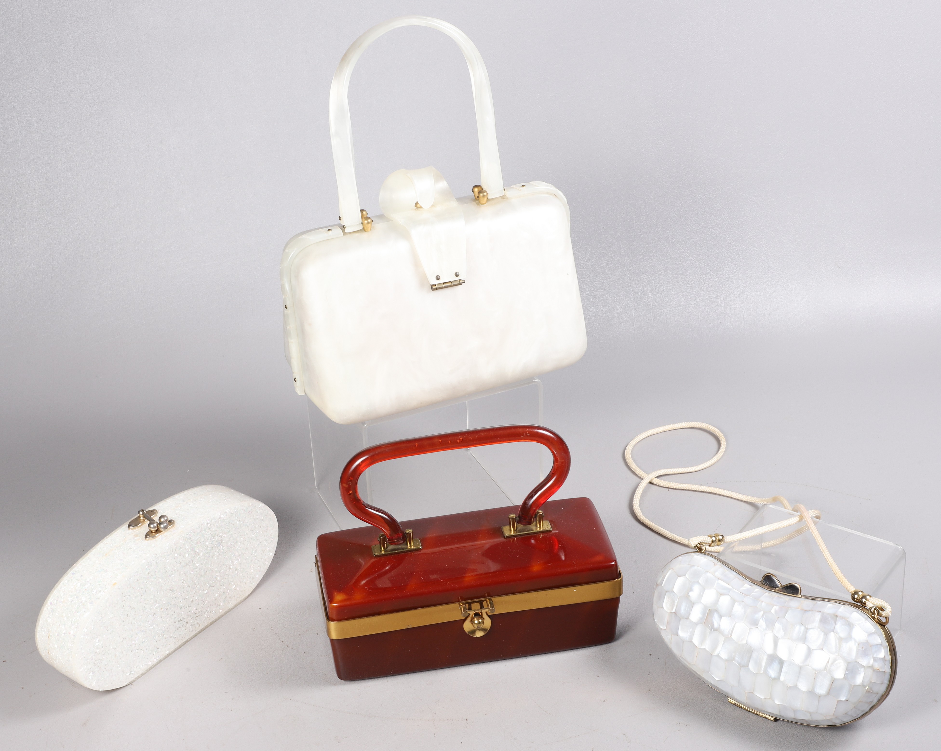 (4) Mid century lucite purses to