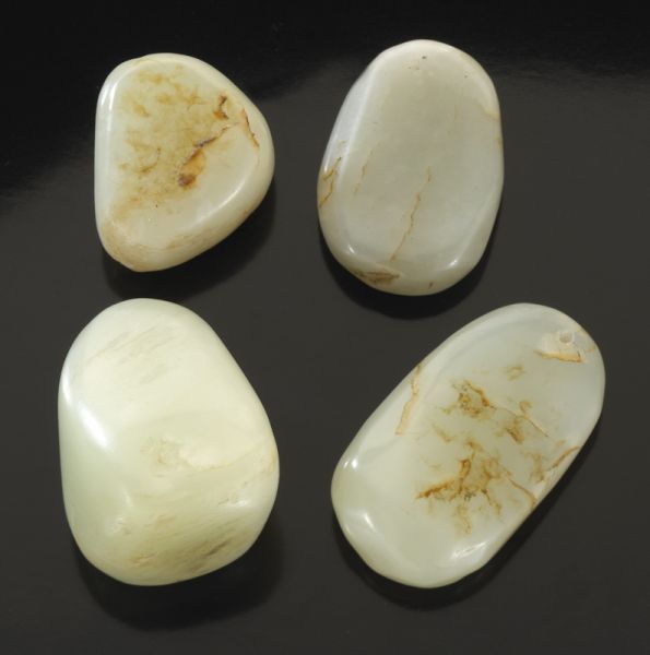 4 Pcs. Chinese pebble jade.Largest: