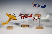 (4) TIN LITHO AIRPLANES ON WOO