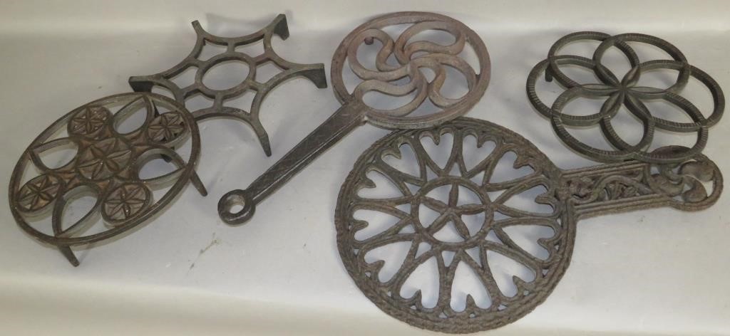 5 CAST IRON TRIVETSca. 1840-1900;