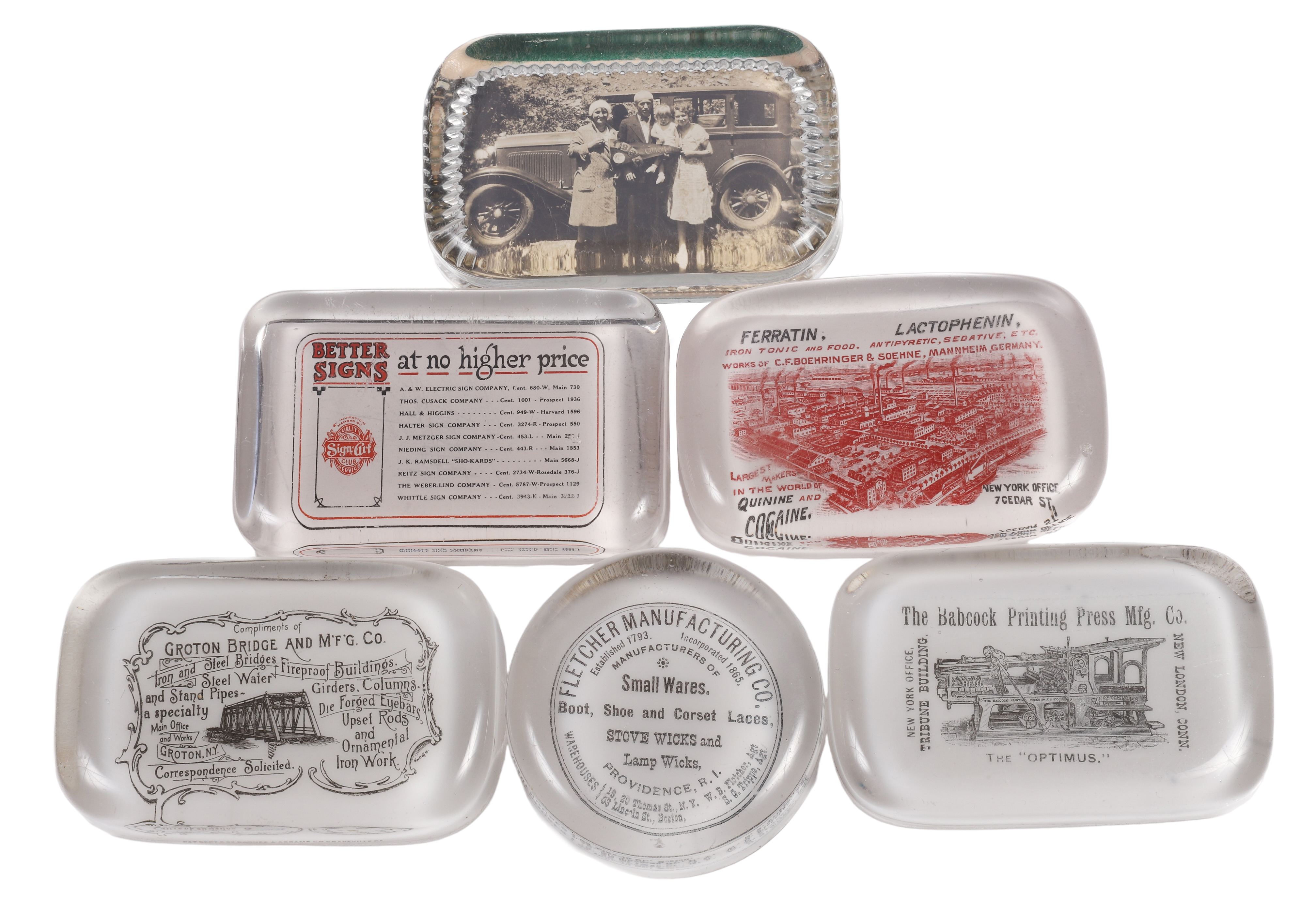(6) Glass advertising paperweights,