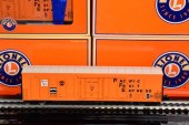 (6) LIONEL BOXCARS AND FREIGHT