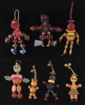 7 BAKELITE CRIB TOYS: A vast a
