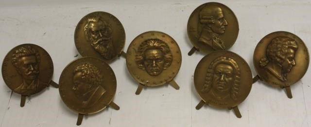 7 BRONZE MEDALLIONS SIGNED A.