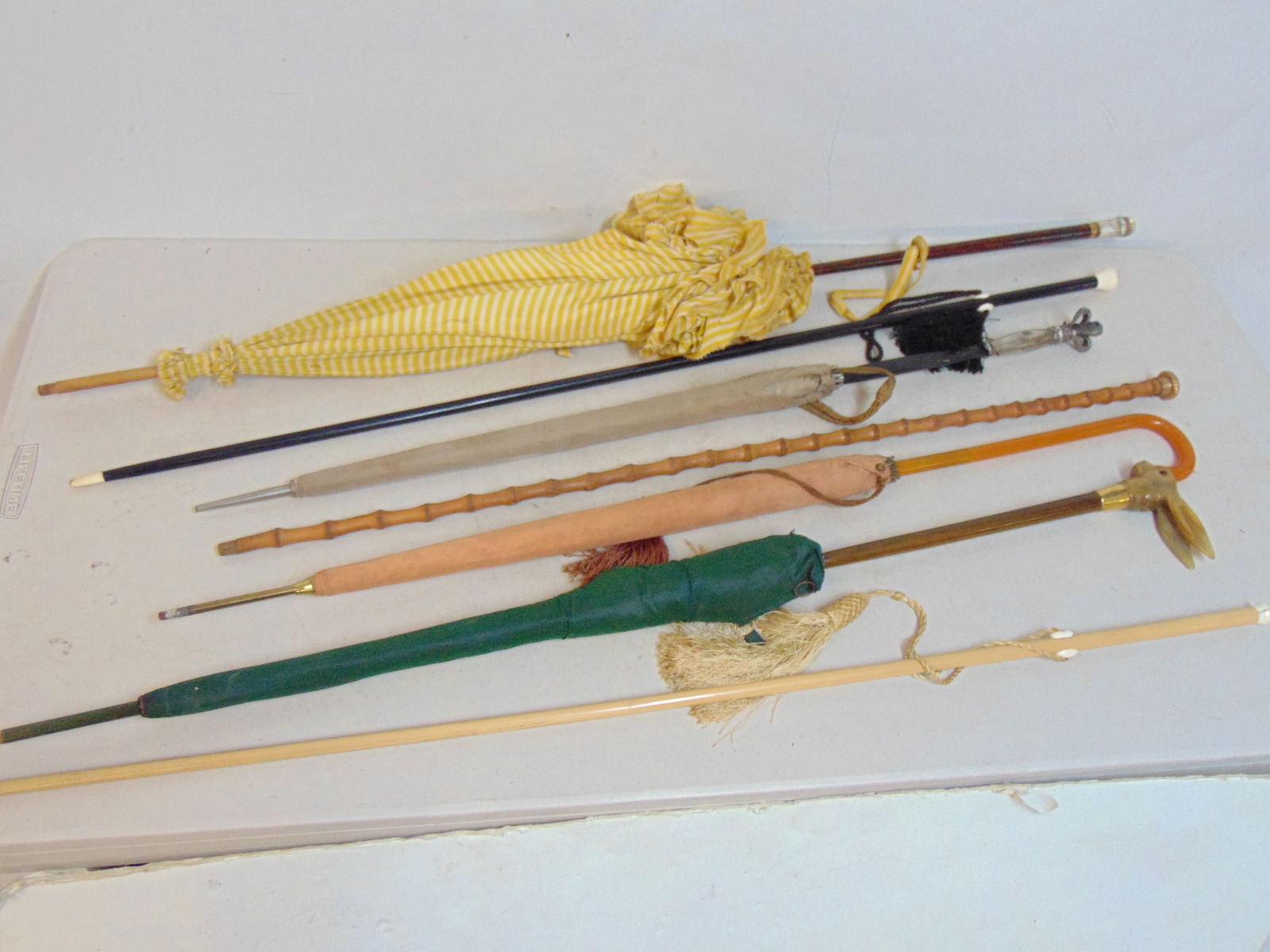7 CANES & UMBRELLAS OR PARASOLS,