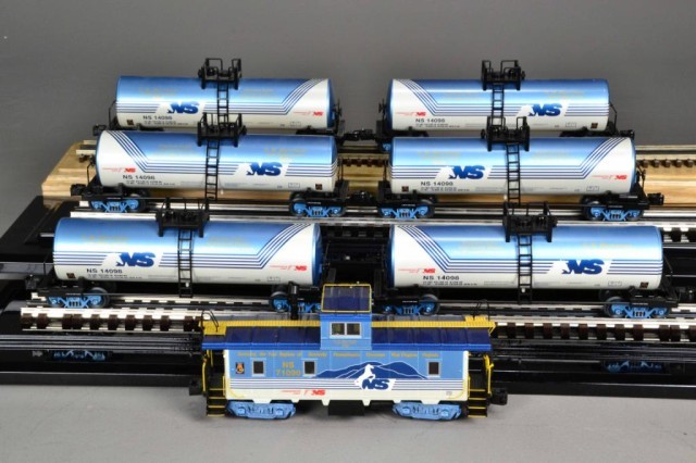 (7) LIONEL TANK CARS AND CABOOSE