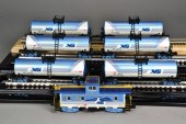 (7) LIONEL TANK CARS AND CABOO