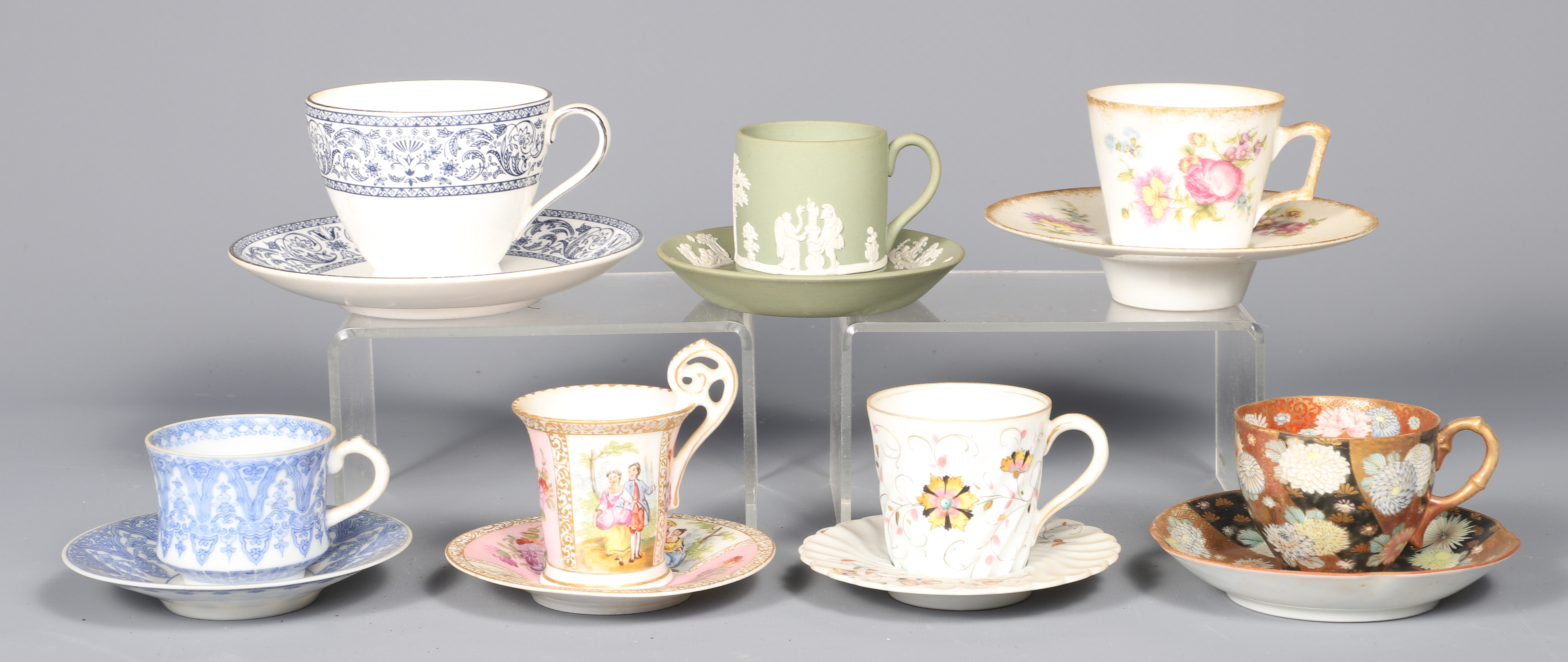 (7) Porcelain cup & saucer sets,