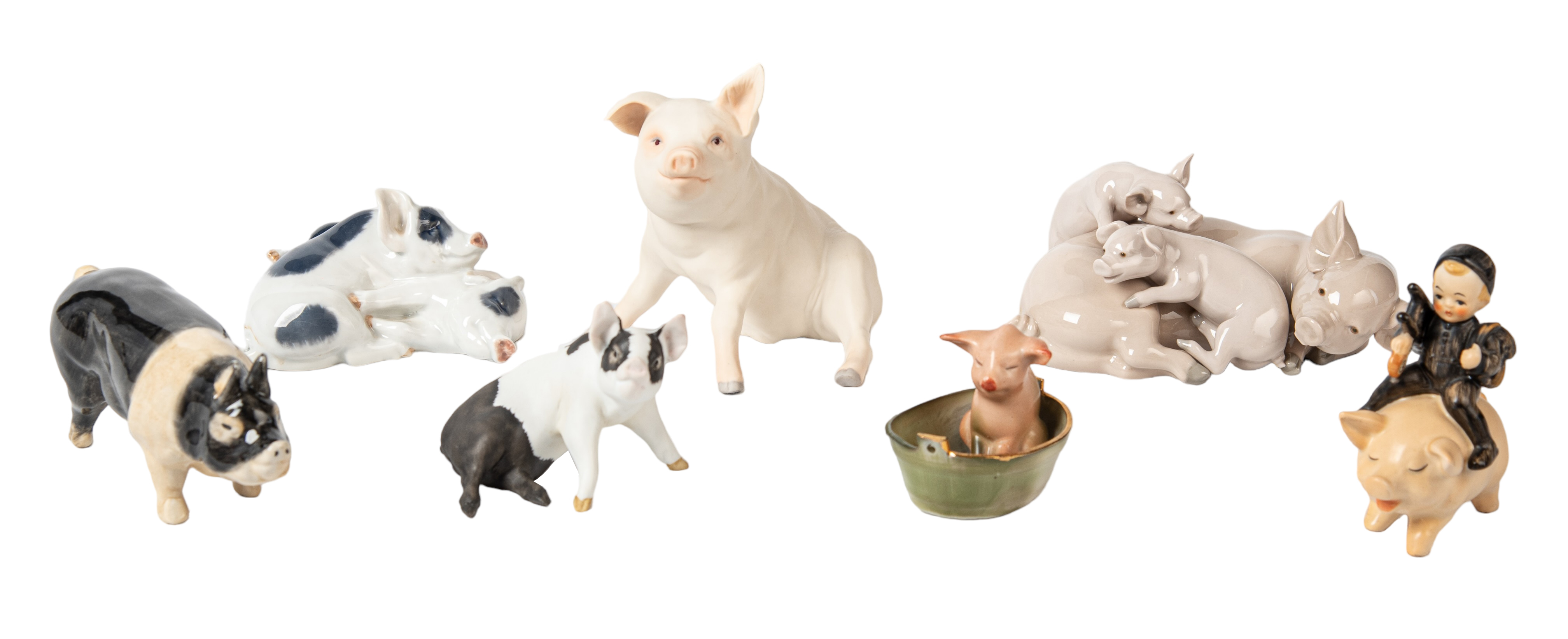 (7) Porcelain pig figurines, c/o
