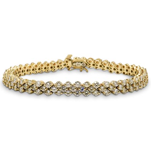 7CT DIAMOND AND 14K GOLD TENNIS