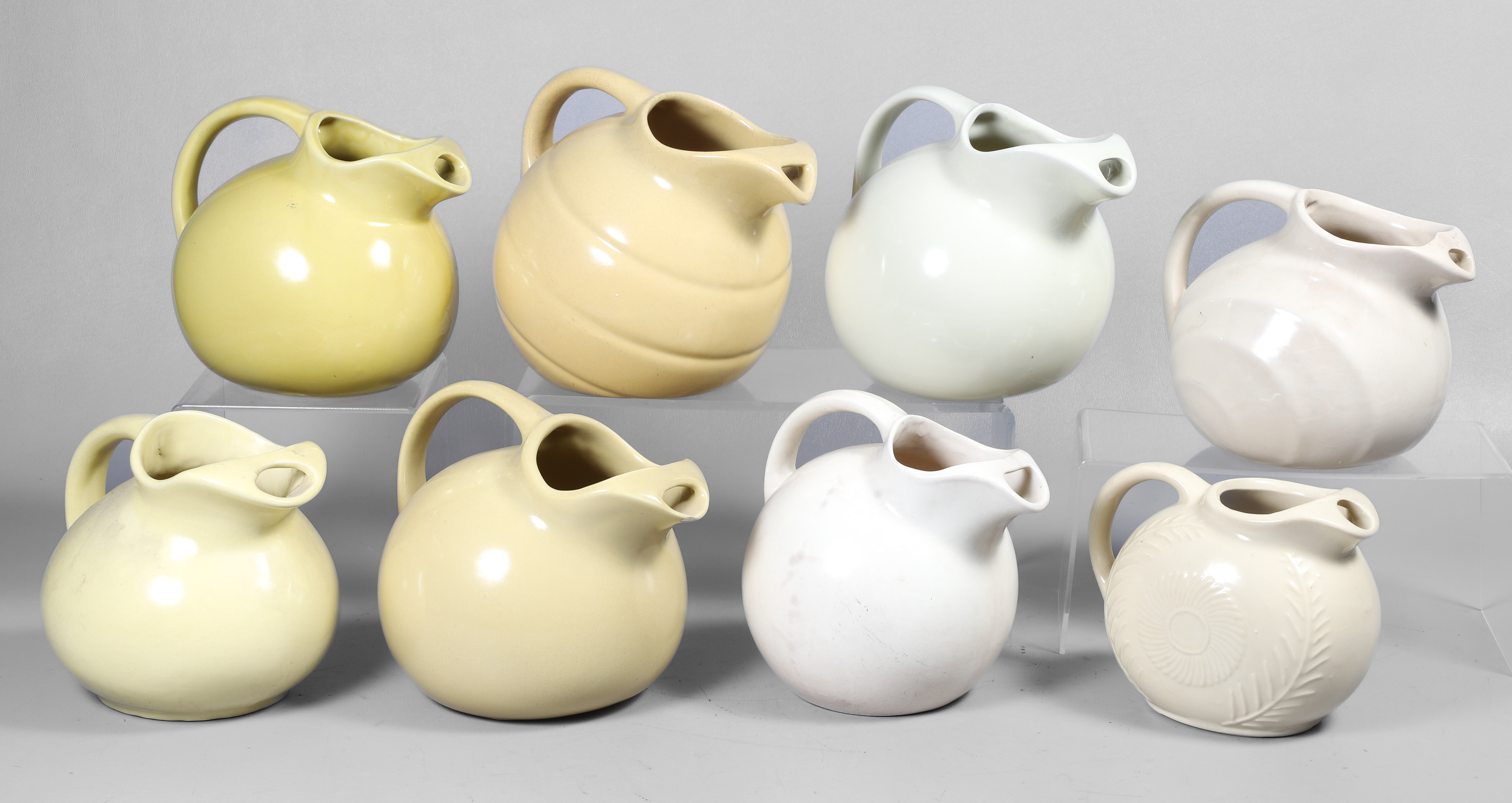 (8) Cream and yellow pottery ball