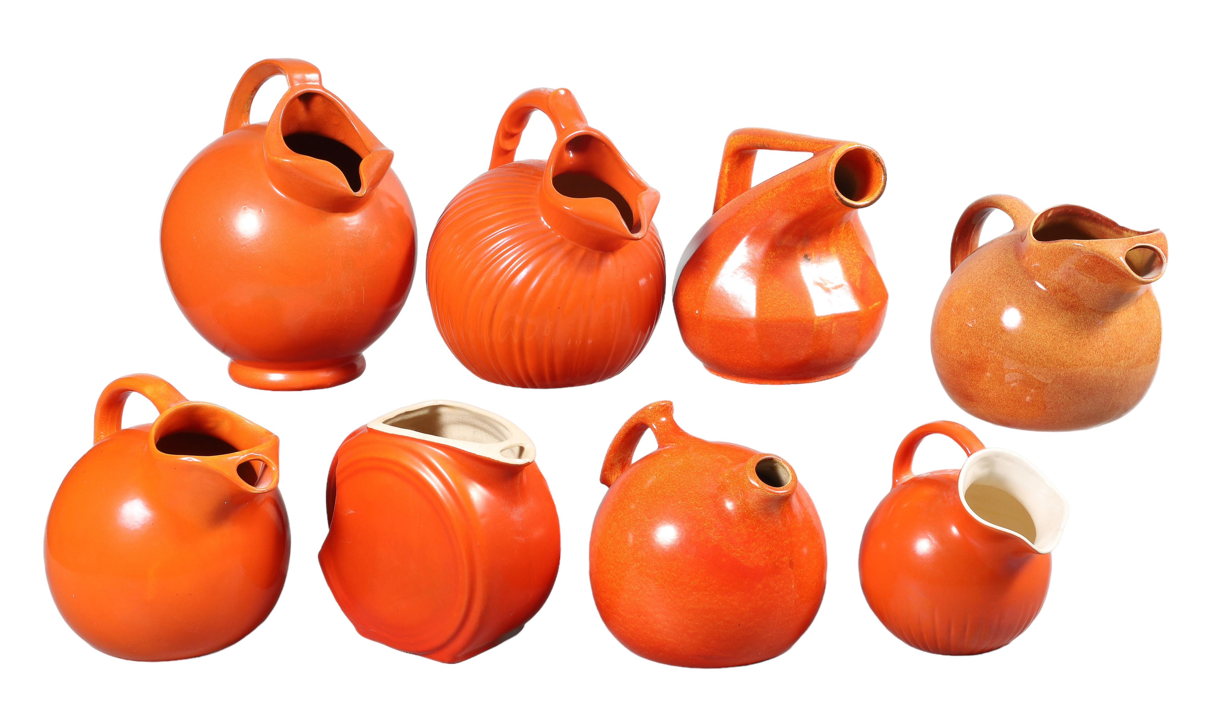 (8) Orange pottery pitchers to