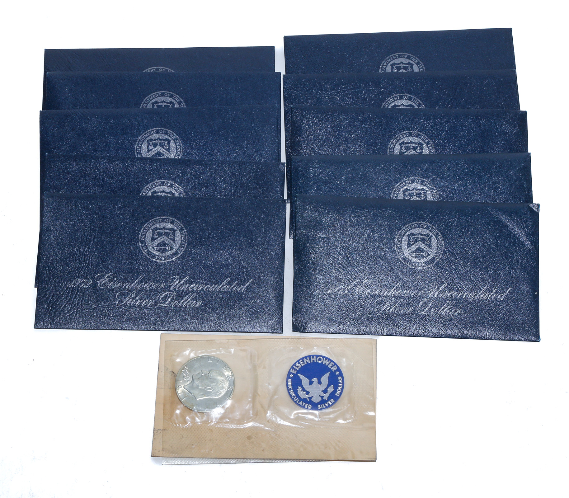 9 IKE SILVER UNC 8 BLUE PACKS & 1