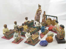 A 13 piece hand carved and