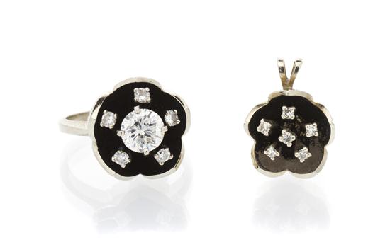 * A 14 Karat White Gold and Diamond