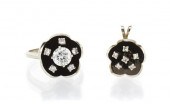 * A 14 Karat White Gold and Di