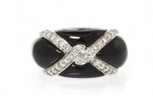 * A 14 Karat White Gold Onyx a