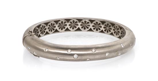 A 14 Karat White Gold and Diamond
