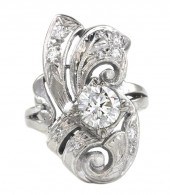 *A 14 Karat White Gold and Dia