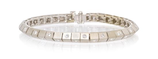 A 14 Karat White Gold and Diamond