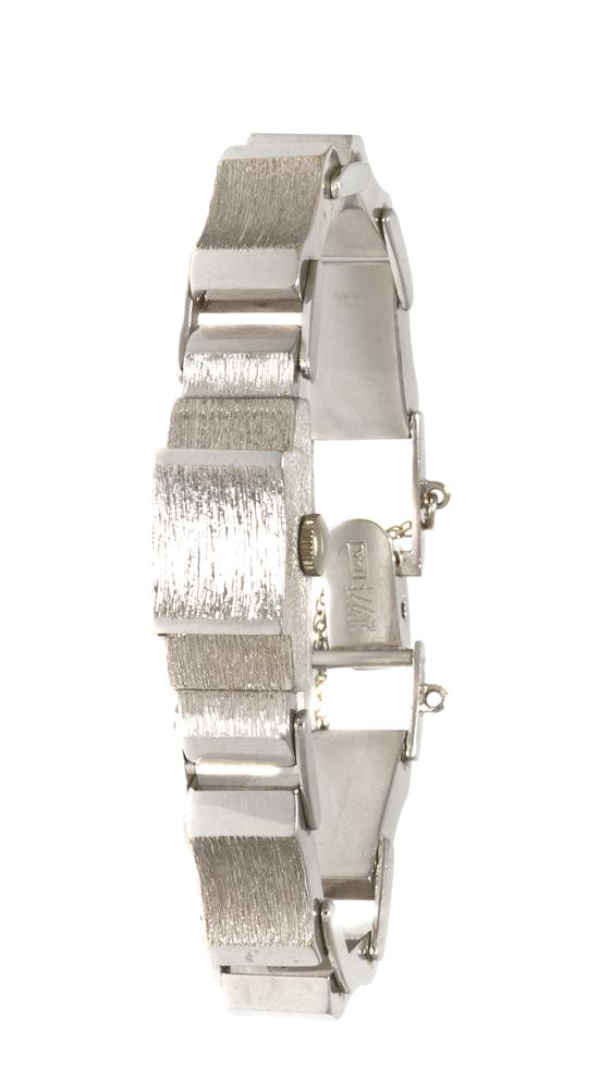 A 14 Karat White Gold Surprise