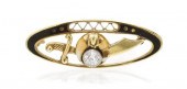 * A 14 Karat Yellow Gold Ename