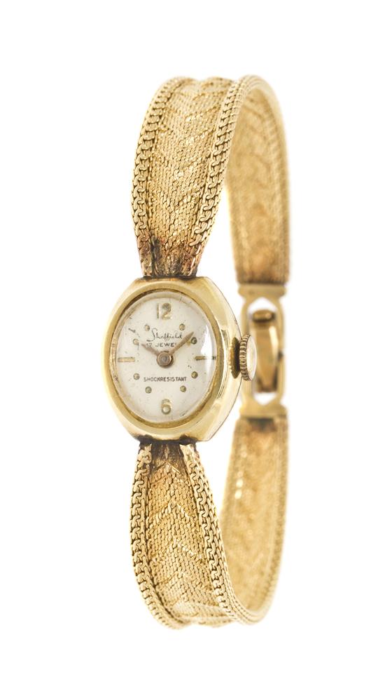 A 14 Karat Yellow Gold Mechanical