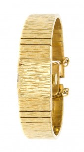 *A 14 Karat Yellow Gold Surpri