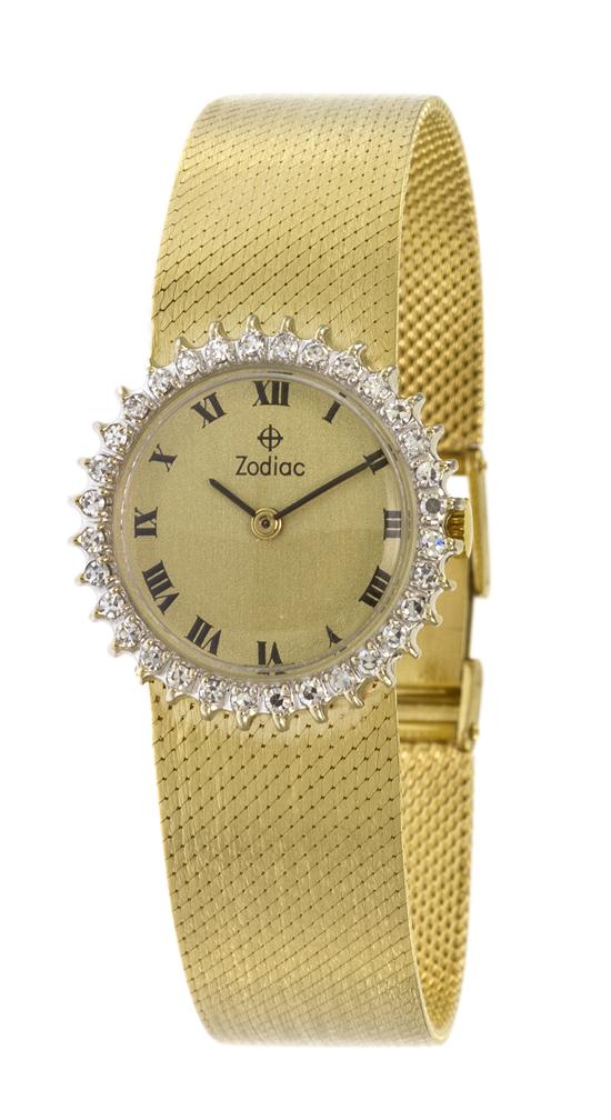 *A 14 Karat Yellow Gold and Diamond