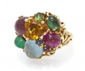 A 14 Karat Yellow Gold Multi G