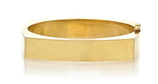A 14 Karat Yellow Gold Hinged