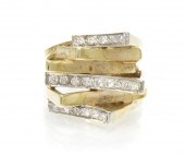A 14 Karat Yellow Gold and Dia