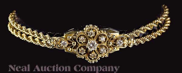 A 14 kt. Yellow Gold and Diamond