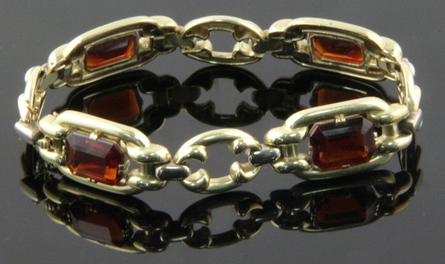 A 14ct gold gem set bracelet with