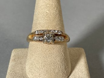 A 14k gold and diamond ring with