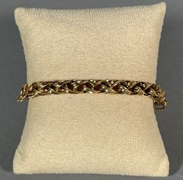 A 14k gold (tested) woven chain