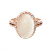 A 14K ROSE GOLD OPAL RING BY E