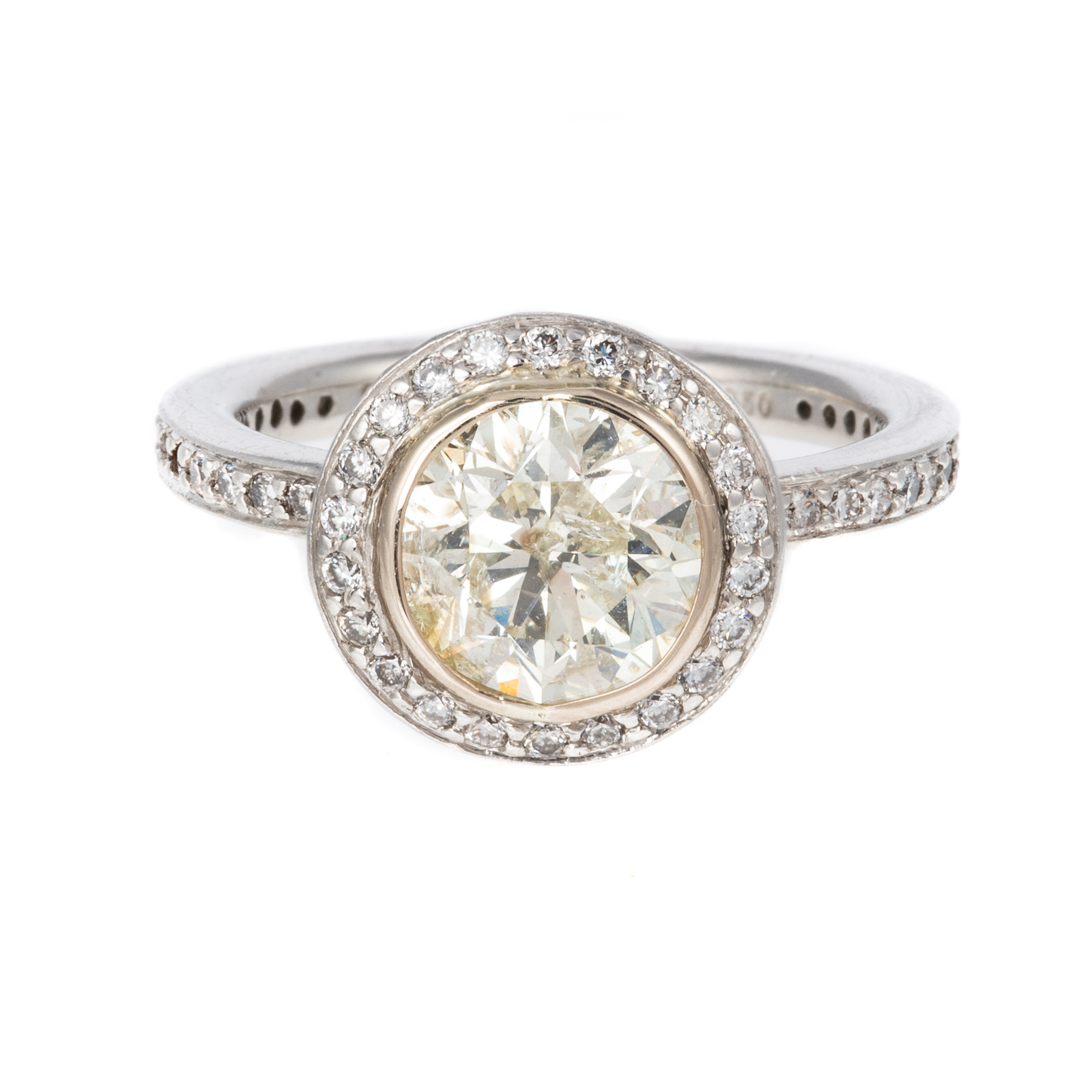 A 1.50 CT BEZEL SET DIAMOND RING IN