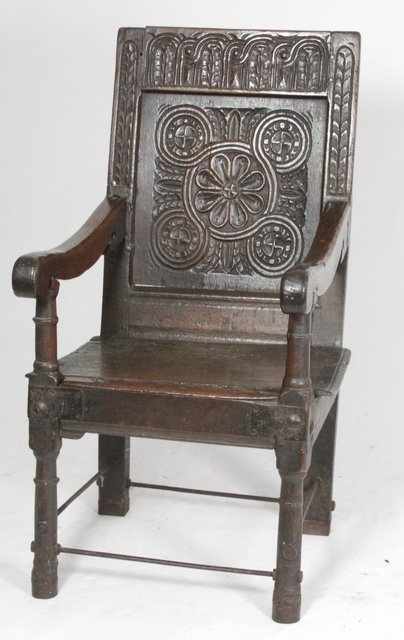 A 17th Century oak carved panel